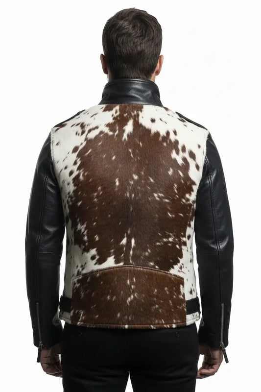 Man wearing a cowhide leather jacket with black leather sleeves on a white background