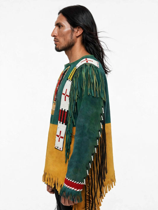 A man shown in profile wearing a long-sleeve suede fringed garment with green, mustard yellow, white, and red beaded details on a plain white studio background.