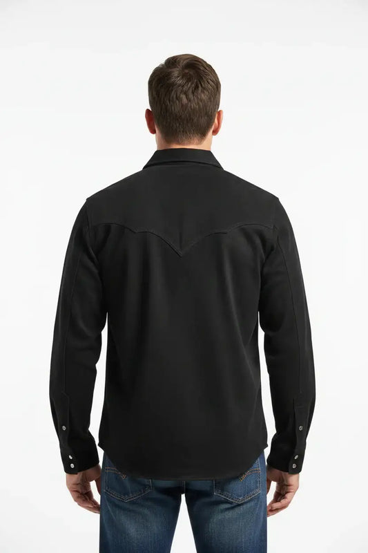 Back view of a man wearing a Zhim Leather Creations black western snap shirt with a western yoke.