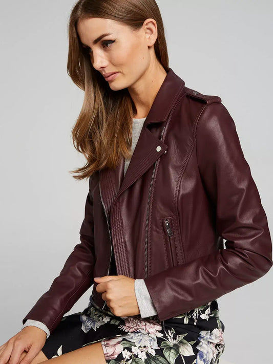 Woman wearing a Zhim Leather Creations burgundy real leather biker jacket.