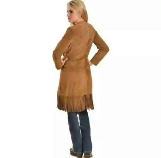 Woman wearing a tan suede fringe cowboy jacket by Zhim Leather Creations