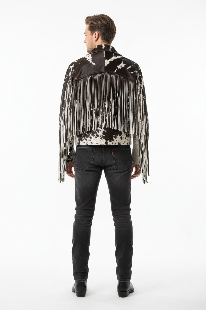 Man wearing a black and white patterned jacket with fringe on a white background