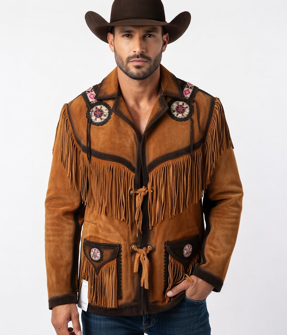 Man wearing a brown suede jacket with fringes and floral patterns, standing against a white background.