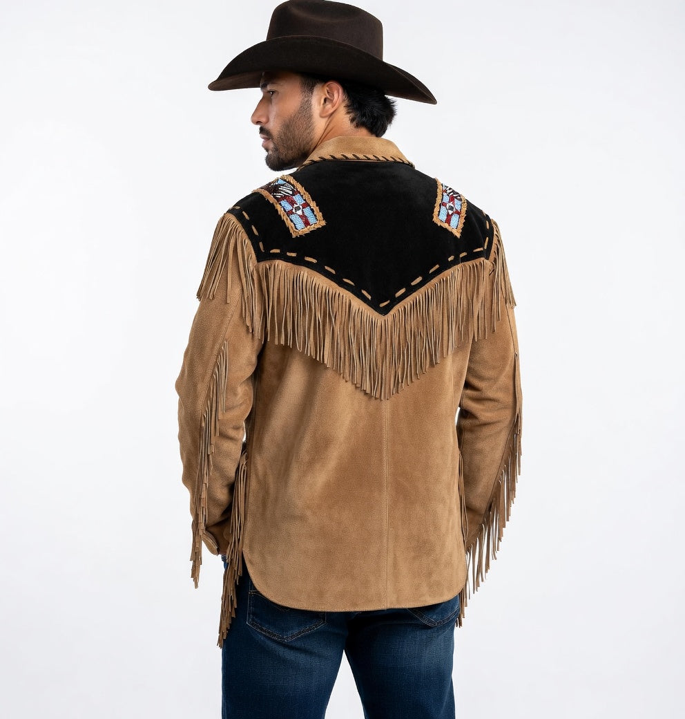 Man wearing a tan suede leather jacket with fringe and embroidery, standing against a white background.
