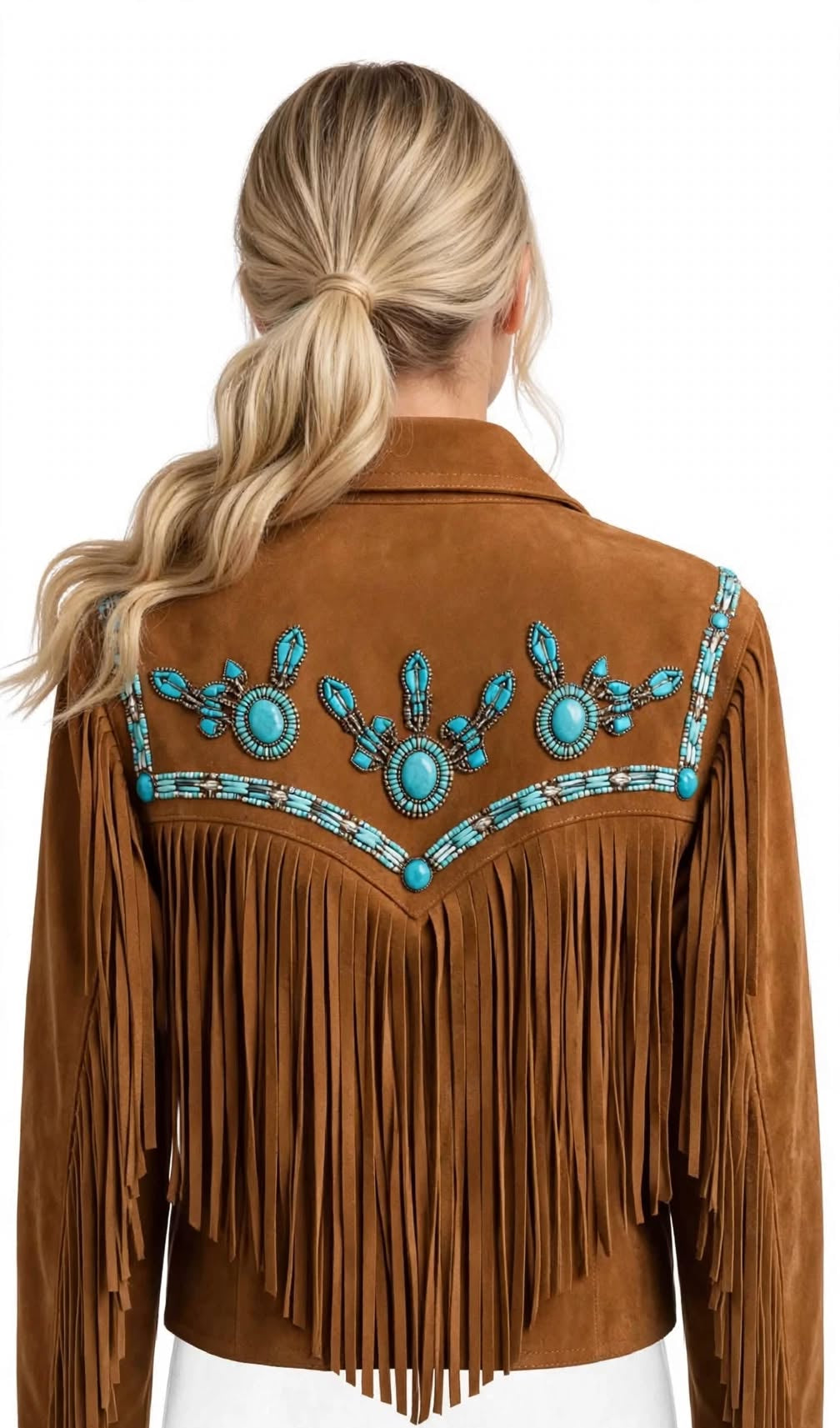A woman viewed from the back wearing a brown suede fringe jacket with turquoise and silver embellishments across the shoulders, paired with white pants, on a white background.