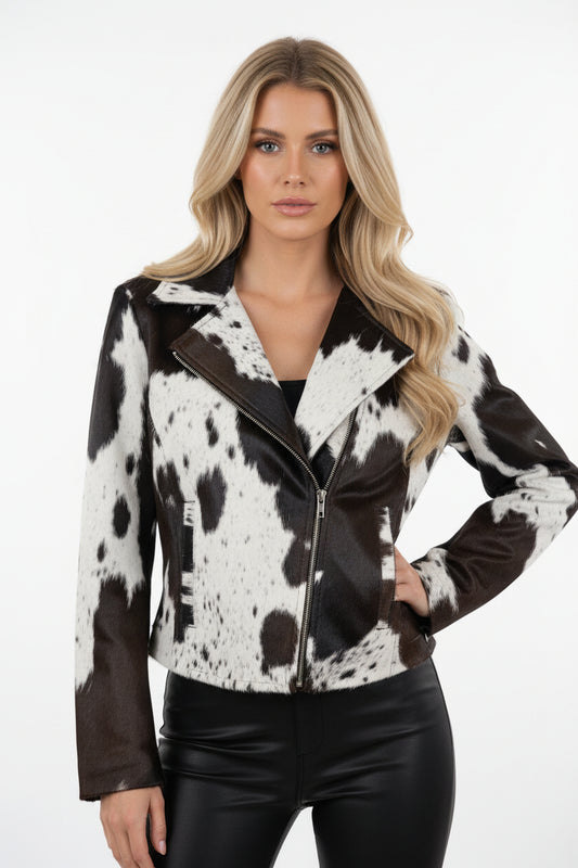 Mannequin wearing a cow print jacket in a store setting