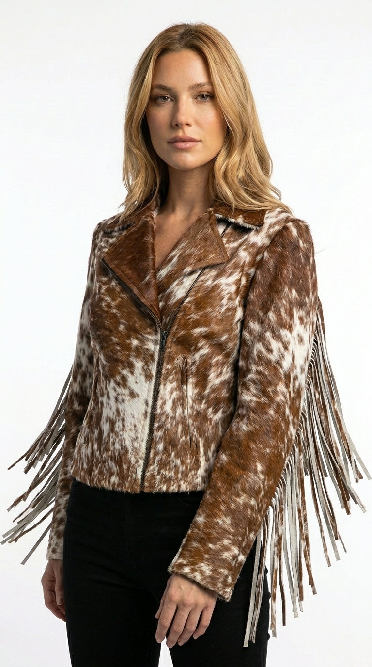 Woman wearing a brown and white patterned jacket with fringes on a white background