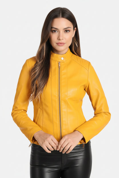 A woman wearing a yellow real leather jacket with a mandarin collar and zipper details, paired with black leather pants.