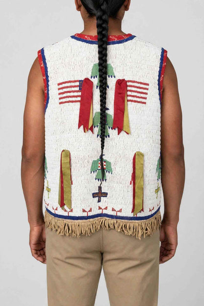 Back view of a men's white beaded fringe vest with tribal patterns by Zhim Leather Creations