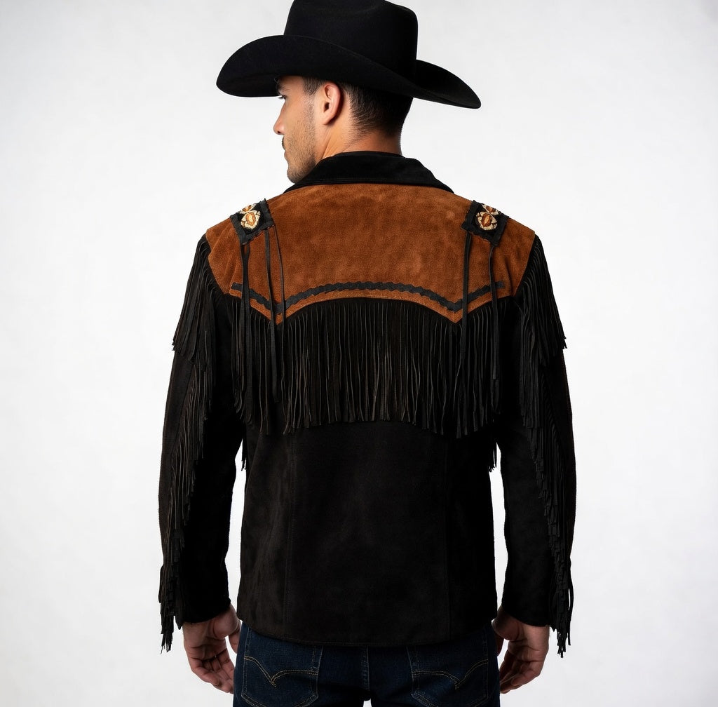 Man wearing a black and brown fringed leather jacket with a cowboy hat on a white background